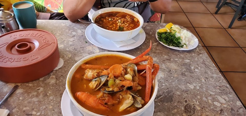 Seafood-focused menu with simple category headings.